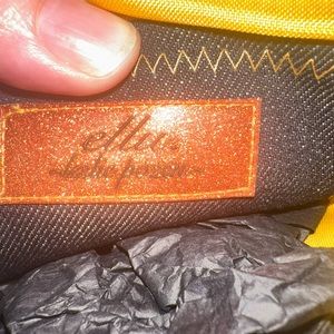 Elegant clutch purse with partial print.